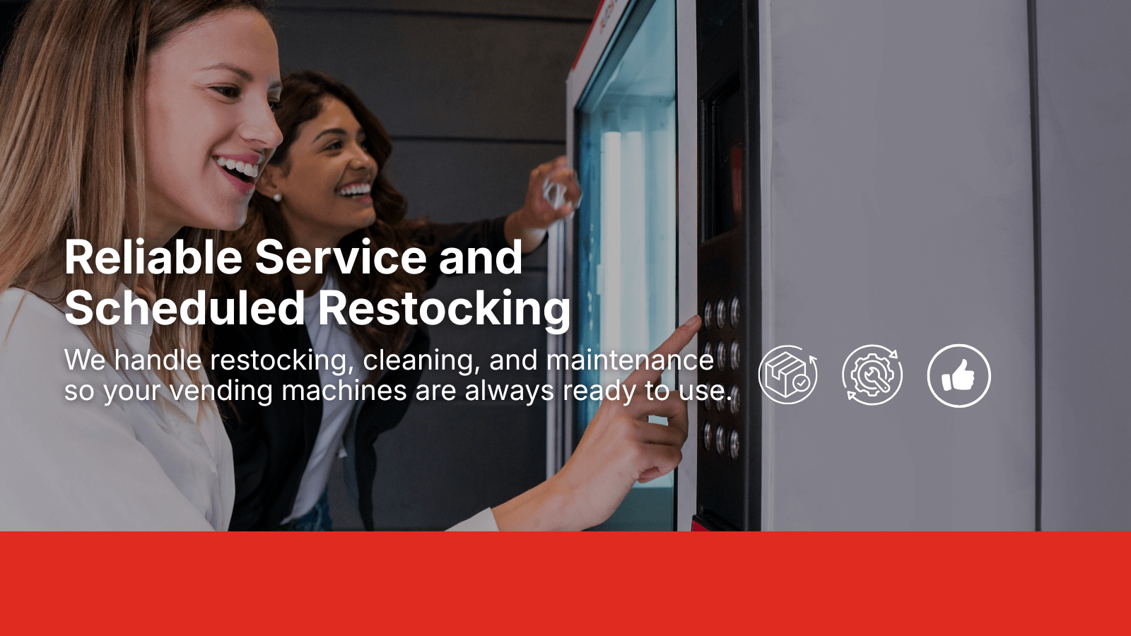 Two women smiling while using a vending machine, representing Enroute Vending restocking, cleaning, and maintenance services.