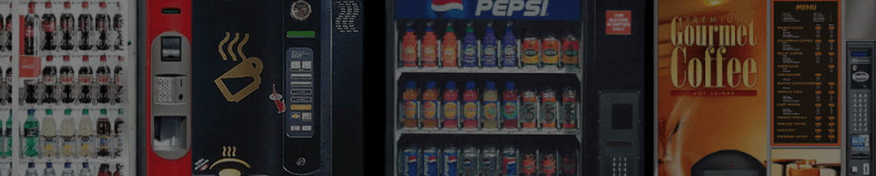 Lineup of vending machines stocked with snacks and drinks.